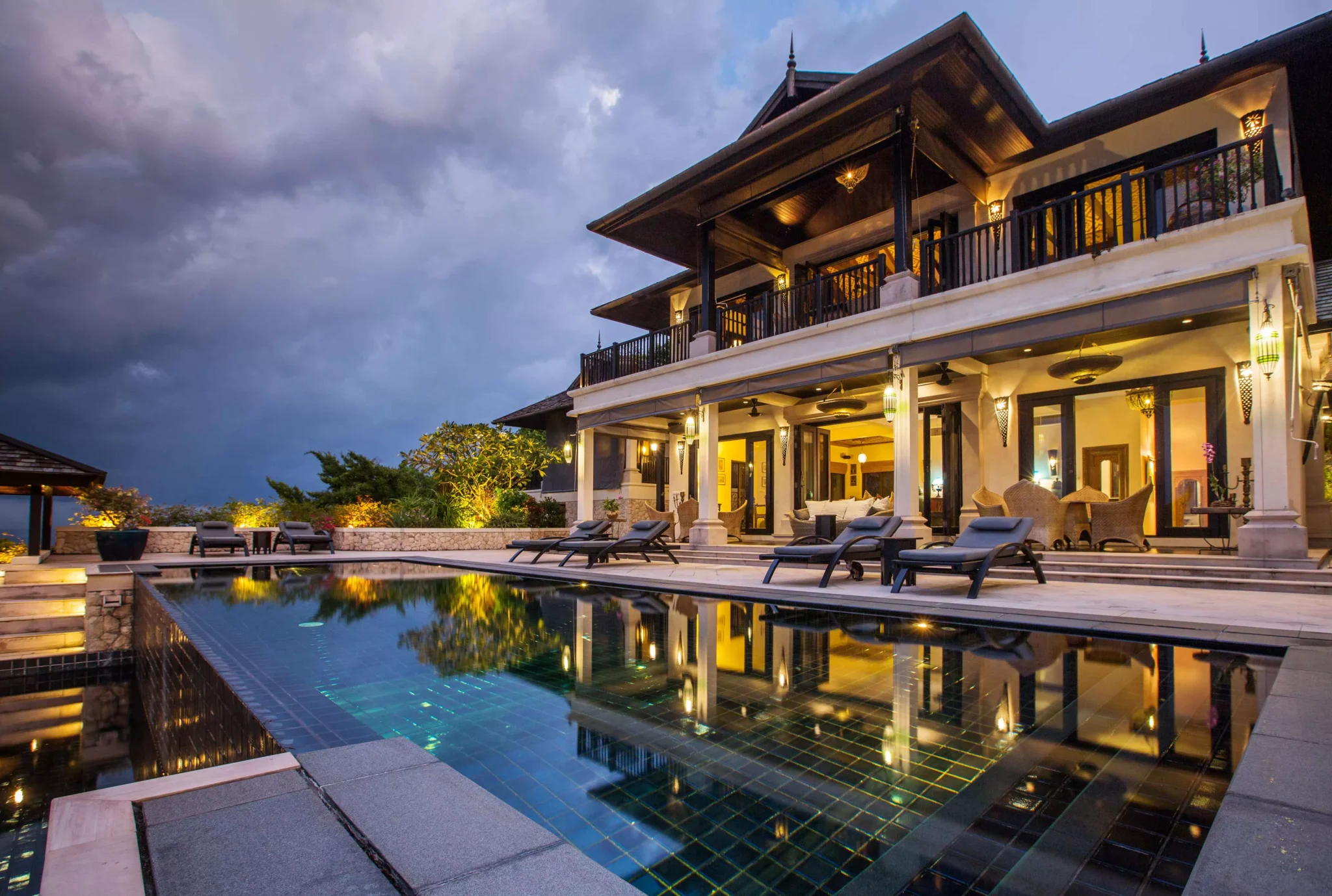 big mansion luxury pool night time